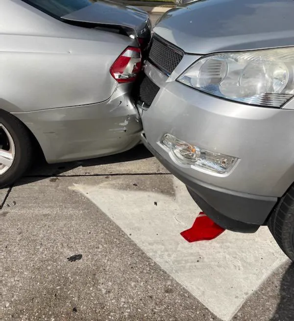 Rear-end collision damage between a car and an SUV